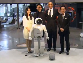 US President Barack  Obama plays soccer with Honda‘s  high-tech robot Asimo in Japan